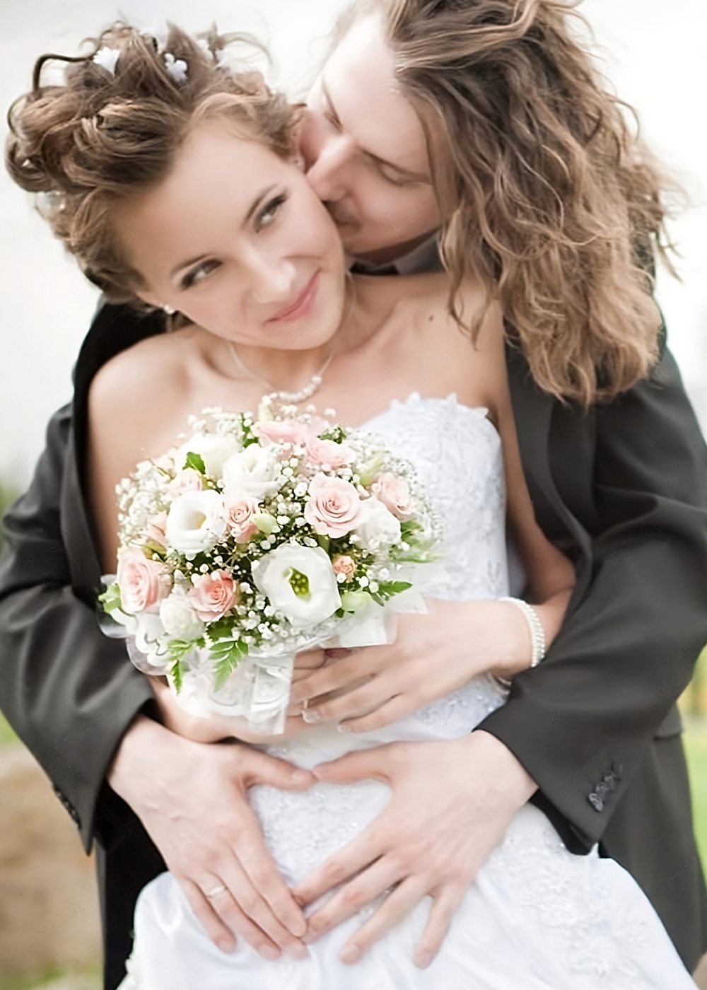 Wedding couple holding each other following ceremony