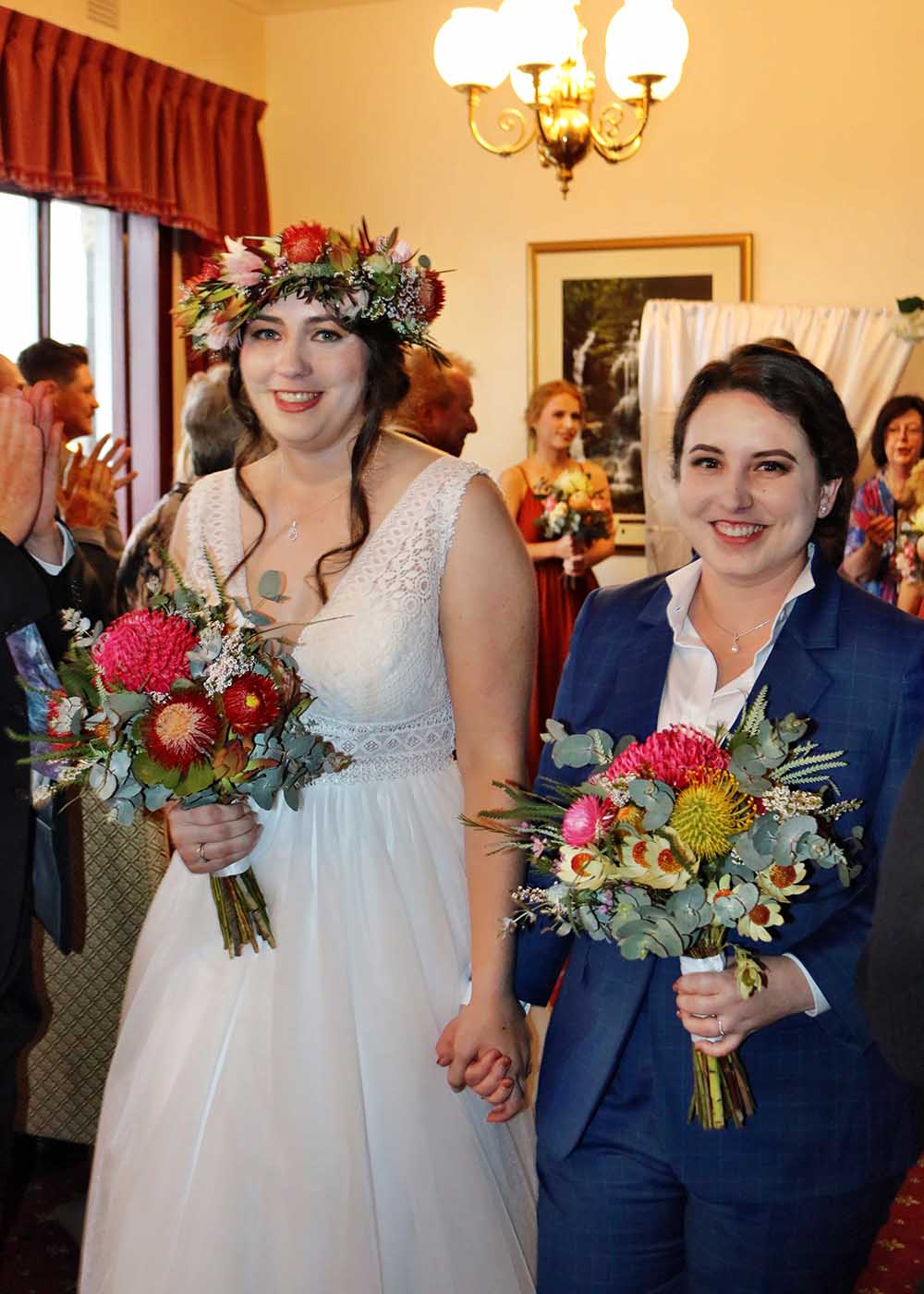LGBTQI couple walk back down the aisle after their wedding ceremony at Mountain Heritage Hotel, Katoomba with Blue Mountains Wedding DJ MC