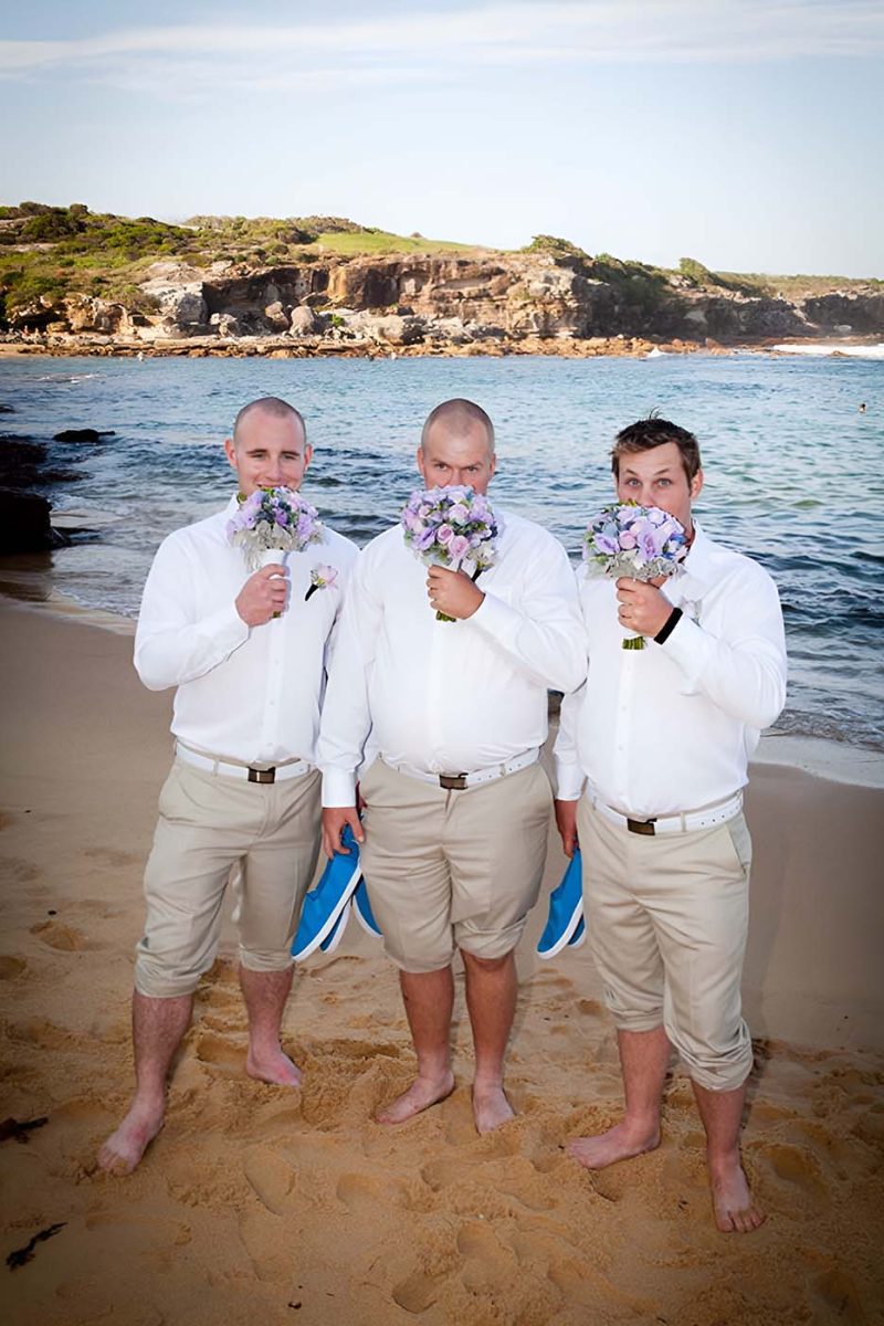 Groomsmen with floral bouquets